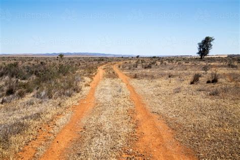 Image Of Dirt Tracks Through Dry Plains Austockphoto