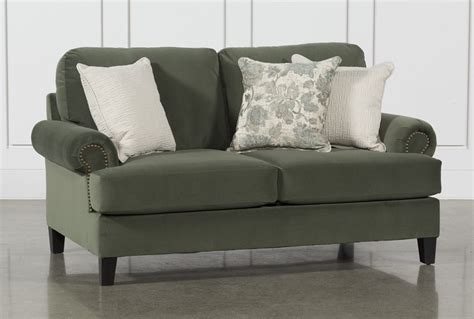 Designing a colourful home décor with green loveseat TopsDecor