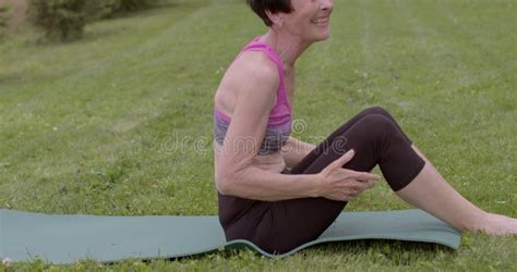 Sporty Y O Mature Woman Beginning Of Solo Outdoor Yoga Classes At Older Age Stock Video