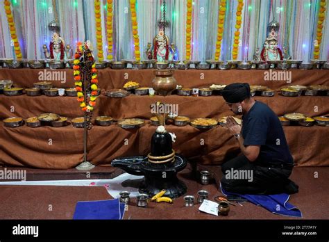 A Sikh devotee prays during Diwali and New year Hindu celebrations, in ...