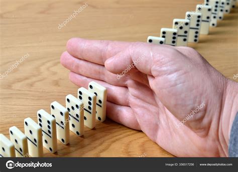 Domino Effect Chain Reaction Stopped Human Hand Stock Photo By