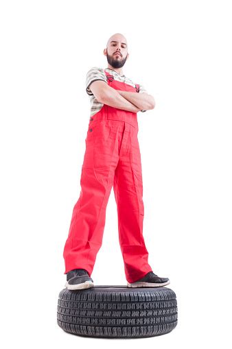 Hero Shot Low Angle Of Proud And Confident Mechanic Stock Photo