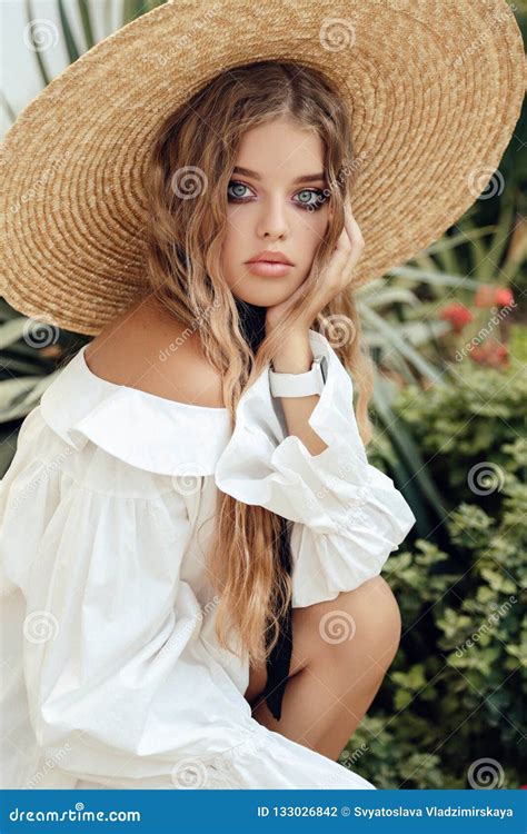 Beautiful Young Girl With Long Curly Hair Wears Elegant Straw Ha Stock