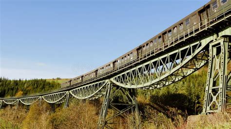 Industrial Steam Engine Locomotive Train Crossing Railroad Tracks Stock