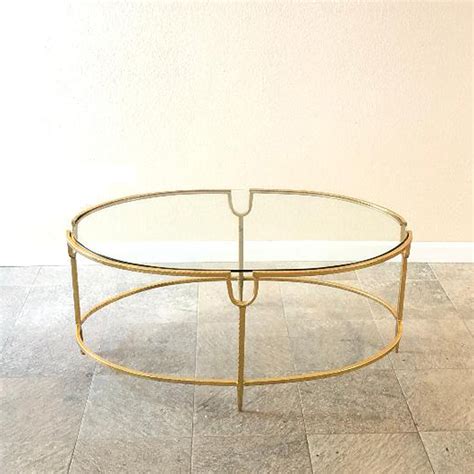 Astrit Glass Oval Coffee Table With Iron Gold Frame Chloe S Vintage Rentals