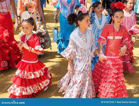 Spanish Girls In Traditional Dress Walking Alongside Casitas At The