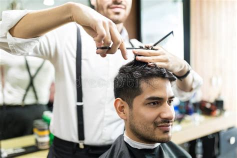 Professional Barber Giving Haircut To Male In Shop Stock Image Image