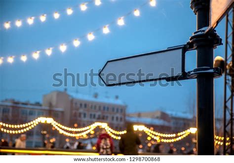 Blank Directional Road Signs Against Blue Foto Stock 1298700868