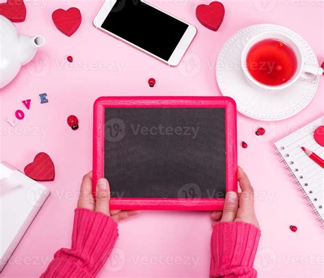 Two Female Hands Holding An Empty Black Frame Stock Photo At