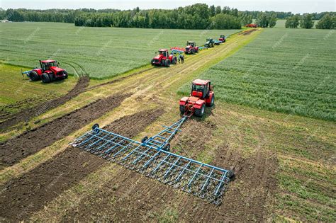 Premium Photo | Agriculture machine harvesting crop in fields tractor pulls a mechanism for ...