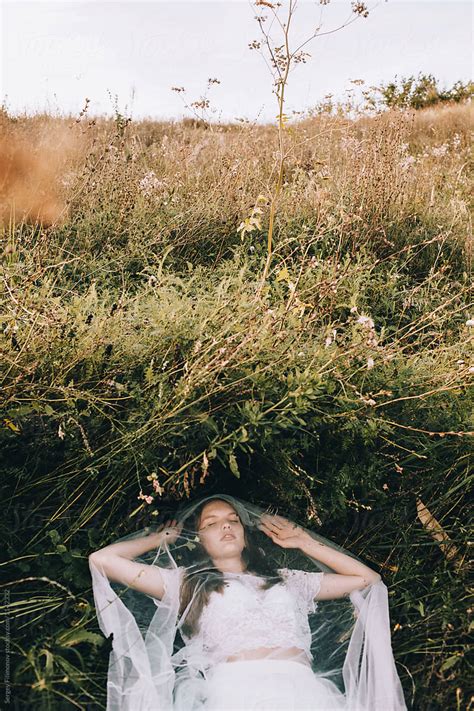 Girl Under Veil In Field By Stocksy Contributor Serge Filimonov