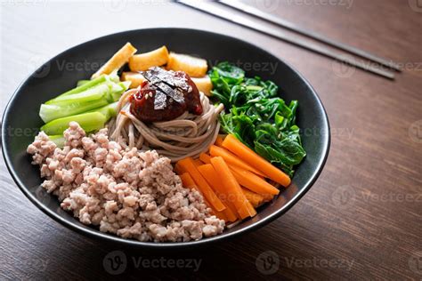 Korean spicy cold noodles 7580627 Stock Photo at Vecteezy