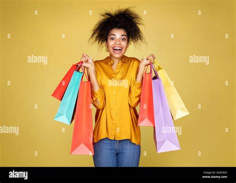 Beautiful Happy Girl Holds Shopping Bags Photo Of African American