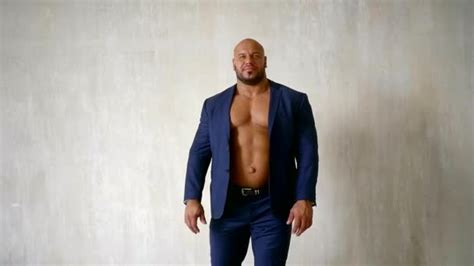 Confident Bodybuilder Dressed In Luxury Blue Suit With Unbuttoned