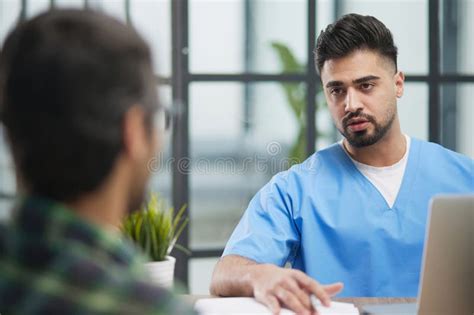 Doctor Receives The Patient And Tells Him About The Results Of The