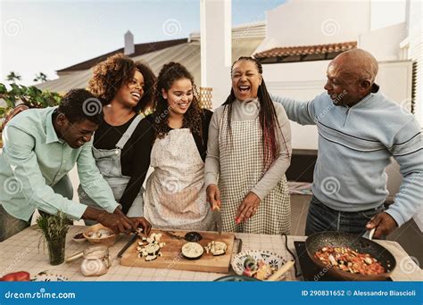 Happy African Family Preparing Food Recipe on House Patio Stock Photo ...