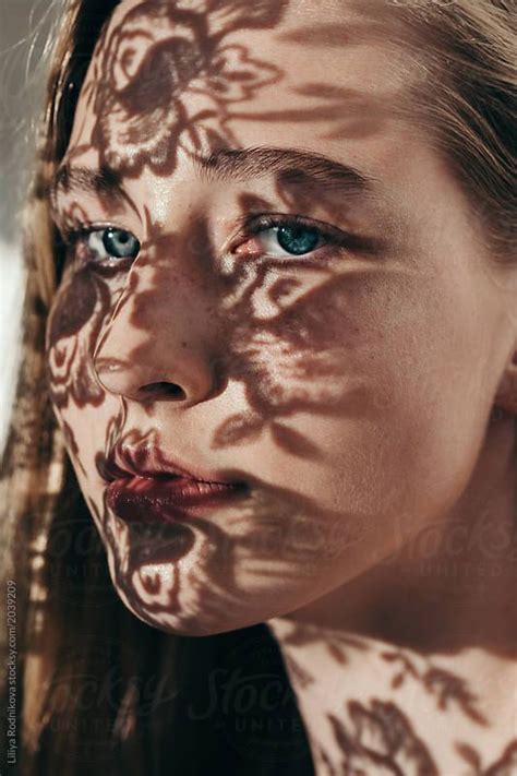 Closeup Portrait Of Amazing Girl With Floral Shadows On Her Face By