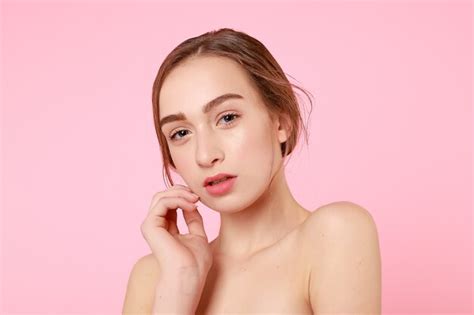 Premium Photo Beautiful Young Girl Touching Her Perfect Skin On Pink Background Skin Care