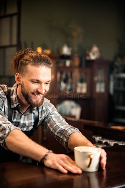 Smiling Young Male Barista Is Working In Coffee Shop Stock Image