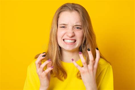 Young Female With Blond Hair In Yellow T Shirt Negative Human Emotions