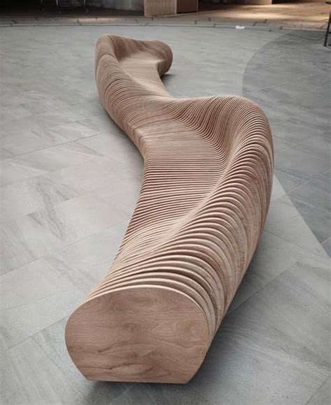 A Wooden Bench Sitting On Top Of A Cement Floor