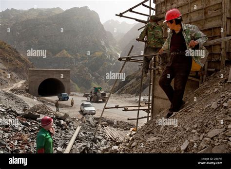 Chinese road construction workers paving constructing roads and Stock ...