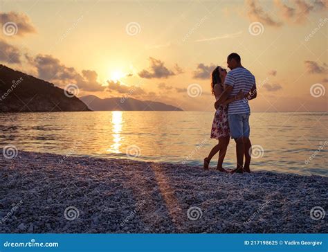 Young Couple In Love Sitting On The Beach Stock Image Image Of Happy