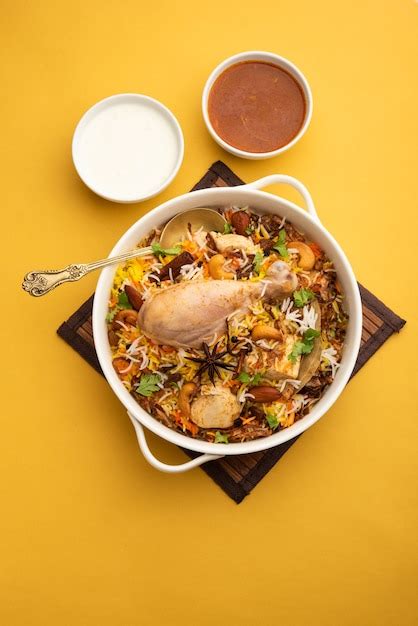 Premium Photo Restaurant Style Spicy Chicken Biryani Served With