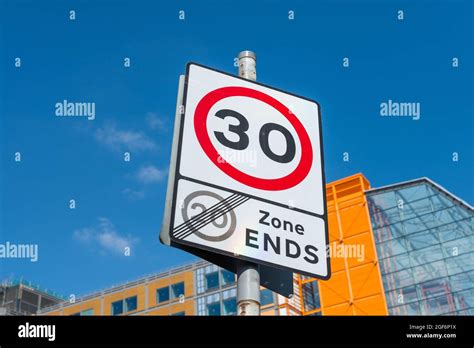 Traffic Sign Saying 20mph Zone Ends And Speed Limit Is 30mph Stock