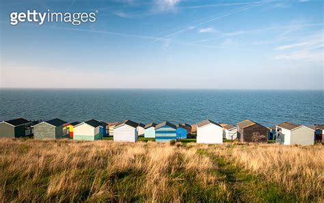 Colourful holiday wooden beach huts facing the sea 1194932180 게티이미지뱅크