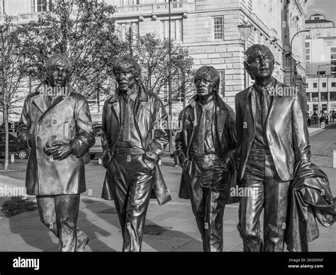 Street Scene In Liverpool With The Bronze Statues Of The Famous Beatles