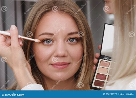 Woman Applying Nude Eye Make Up Close Up In Salon Stock Image Image Of Female Blonde 256288977