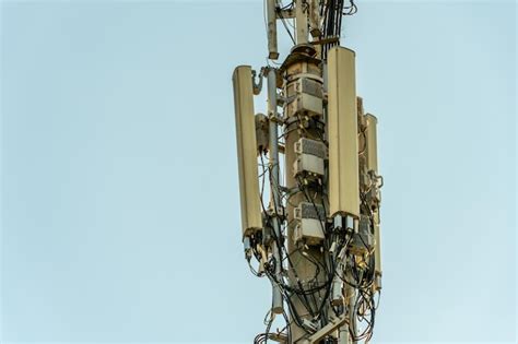 New Gsm Antennas On A High Tower Against A Blue Sky For Transmitting A