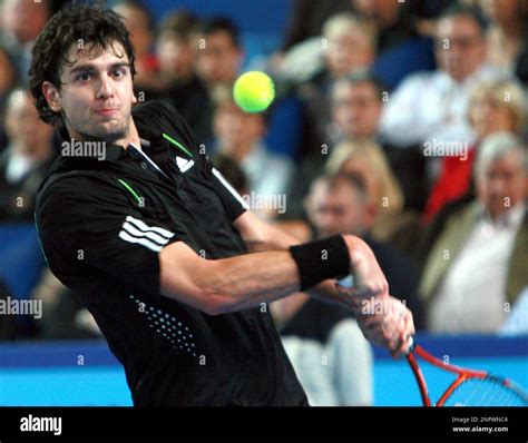 Croatias Mario Ancic Returns A Ball To Britains Andy Murray During