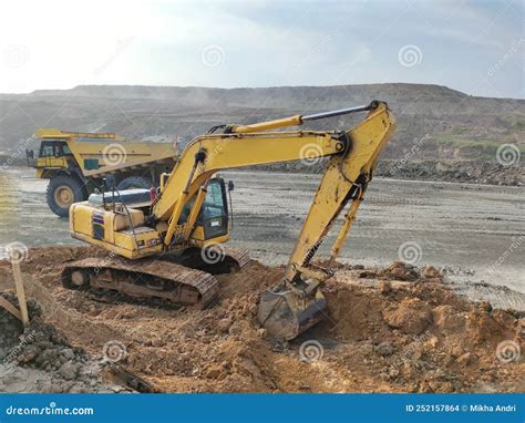 Excavator And Dump Truck Working In Coal Mine Stock Photo Image Of