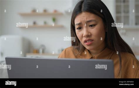 Angry Upset Asian Japanese Woman Girl Homeowner Using Laptop In Kitchen