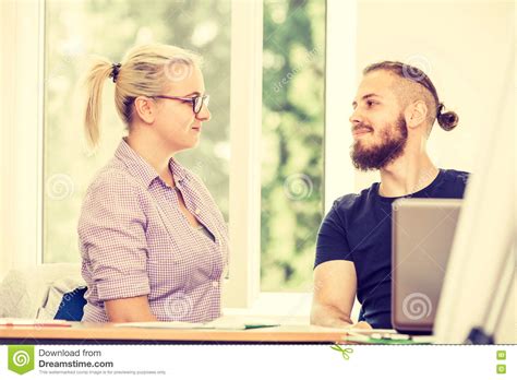 Two Students Talking in Classroom Stock Photo - Image of university, teenage: 79889750