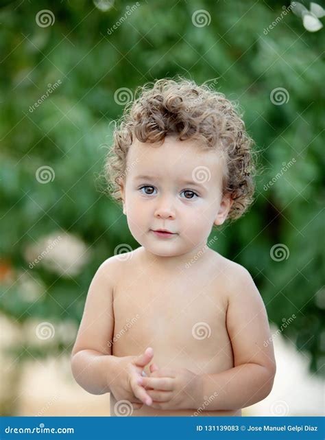 Beautiful Baby With Curly Hair In The Garden Stock Image Image Of