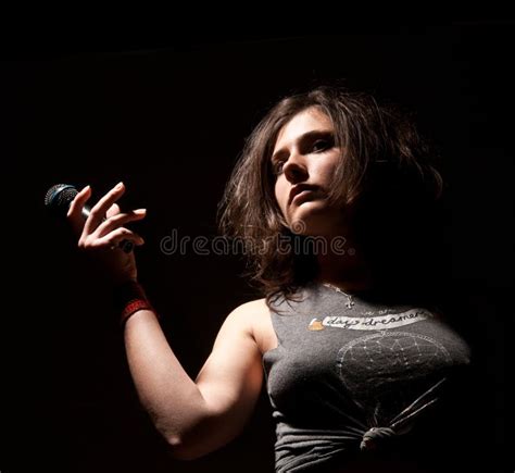 Girl and by a microphone stock image. Image of musical - 25016655