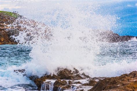 Close Up Of A Wave Crashing Against A Rock Stock Photo Image Of