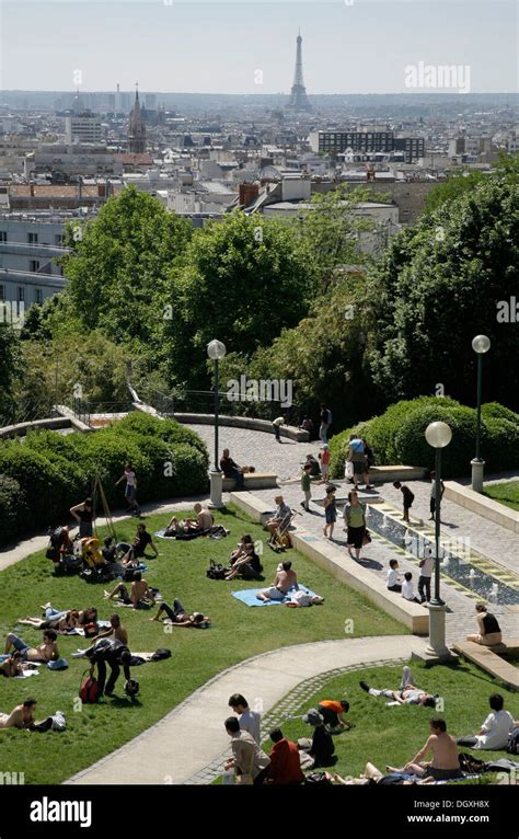 Parc De Belleville Park People Sunbathing View Of The Eiffel Tower