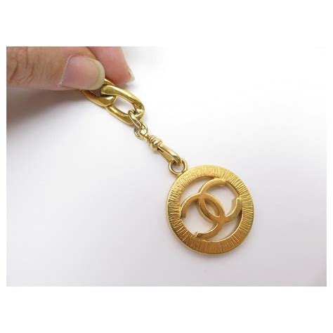 Medaillon VINTAGE CHANEL BELT CHAIN MEDALLION LOGO CC T 75 85 GOLDEN