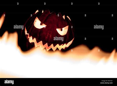 Spooky Smiling Halloween Pumpkin In Hot Burning Hell Fire Flames Stock