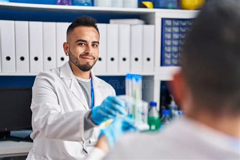 Two Men Scientists Holding Test Tubes At Laboratory Stock Image Image