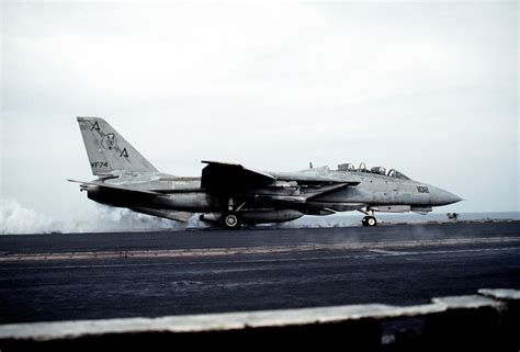 A Fighter Squadron Vf F A Tomcat Aircraft Rolls Down The No