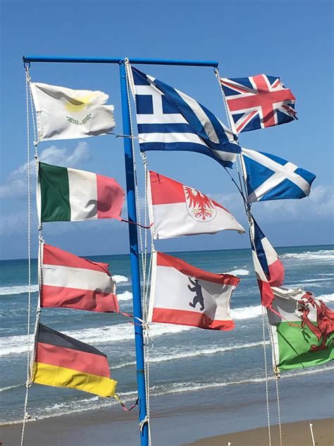 Flags on the beach at San Stefanos, Corfu, Greece : r/vexillology