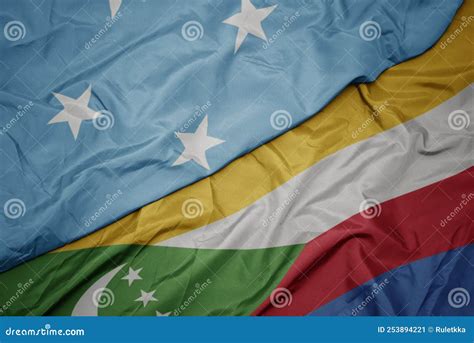 Waving Colorful Flag Of Comoros And National Flag Of Federated States