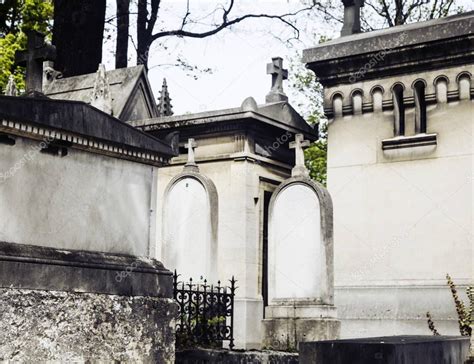 Tombstones In Cemetery At Dusk — Stock Photo © Iordani 129972952