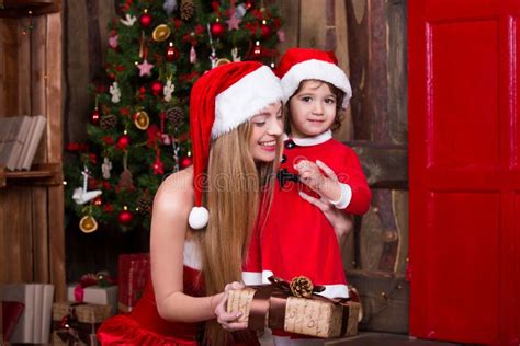 Two Santa Girls Decorating Christmas Tree Having Fun New Year Interior