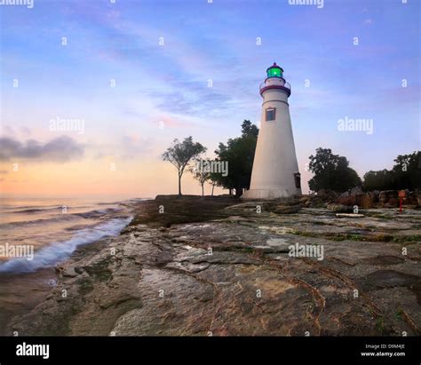 The Marblehead Lighthouse Bathed In The First Light Of Dawn On A Foggy